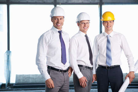Men in helmets on a construction site