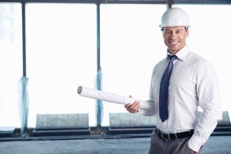 A man in a helmet on a construction siteの写真素材