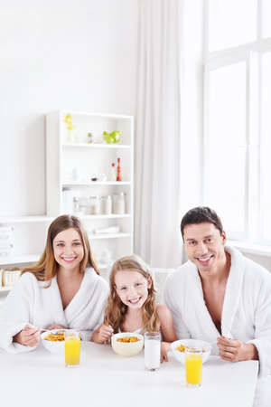 Family with a child has breakfastの写真素材