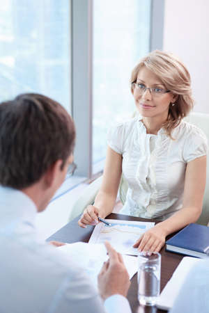 Mature business woman in officeの写真素材