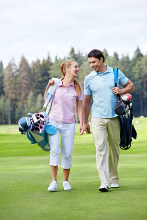 The happy couple on the golf courseの写真素材