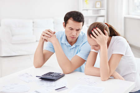 Young couple for the calculations at home