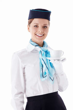 Stewardess with a cup on a white backgroundの写真素材