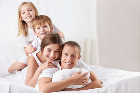 Families with children in the bedroomの写真素材