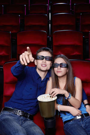 Young couple in a movie theaterの写真素材