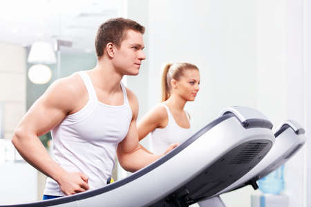 Young people on treadmillsの写真素材