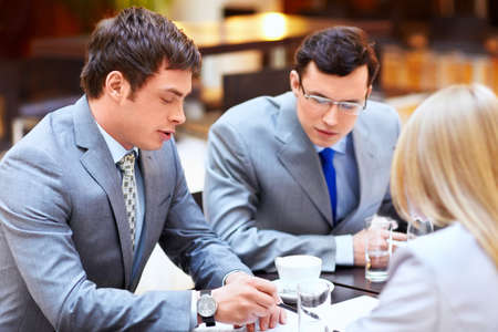Businessmen with laptop in officeの写真素材