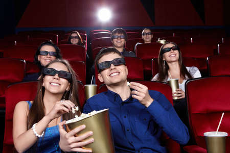 Smiling people in the cinemaの写真素材