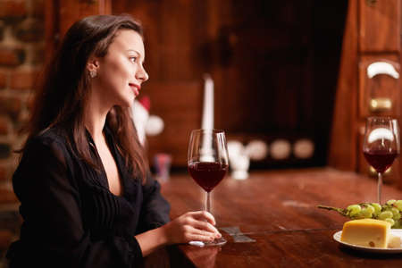 Attractive girl in a restaurantの写真素材