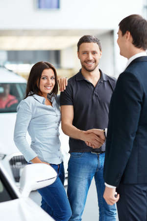 Seller and a couple in the showroom