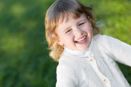Happy little girl outdoorsの写真素材