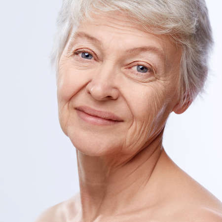 Elderly woman on a white background