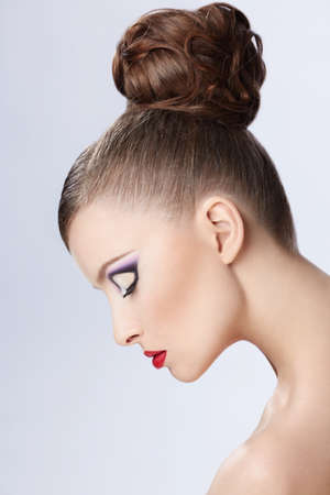 Beautiful girl with a hairstyle and make-up