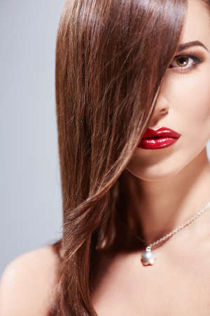 Beautiful girl with make-up in studioの写真素材