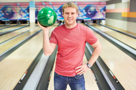 Young attractive man in bowlingの写真素材
