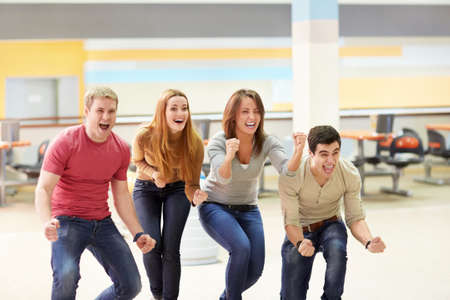 Emotional young people in bowlingの写真素材