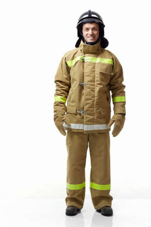 Mature fireman in uniform on a white backgroundの写真素材