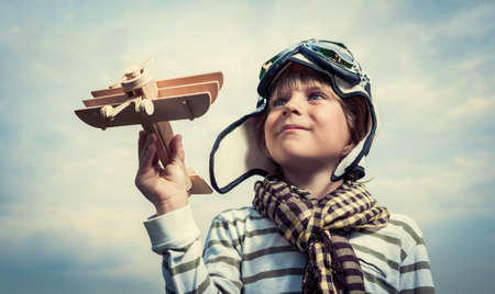 Pilot with airplane on a background of skyの写真素材
