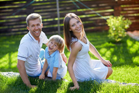 Families with a child on a lawnの写真素材
