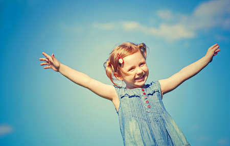 Happy girl on the background of sky
