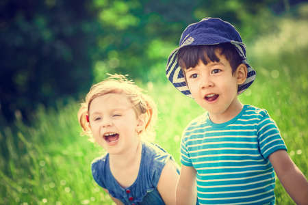 Surprised children in a field
