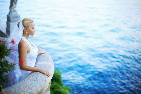Young beautiful bride on the balconyの写真素材