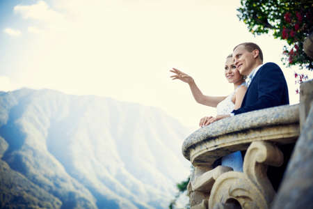Bride and groom on a balconyの写真素材