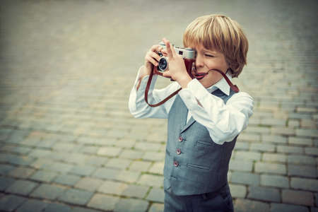 Little boy with a cameraの写真素材