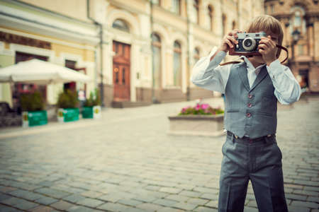 Little boy with a cameraの写真素材
