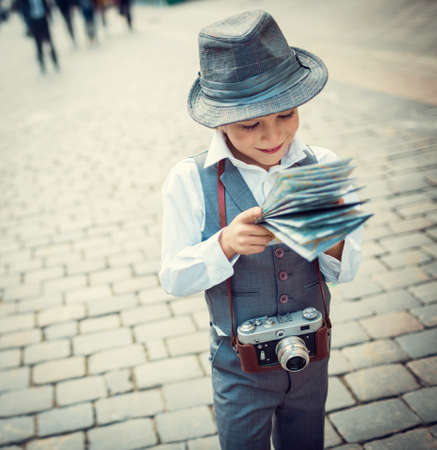 Little boy with map outdoorsの写真素材