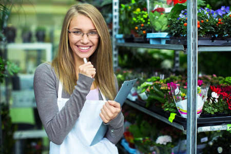 Young saleswoman colors in storeの写真素材
