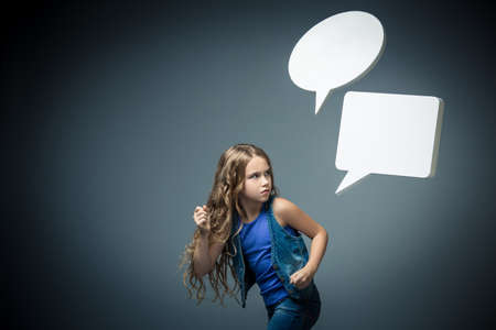 Little girl running away from bubblesの写真素材