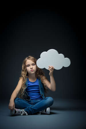 Little girl with bubbles in studioの写真素材