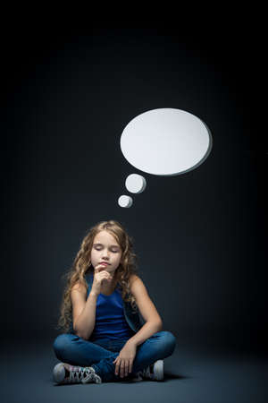 Little girl with bubbles in studioの写真素材