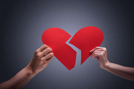 Hands holding broken heartの写真素材