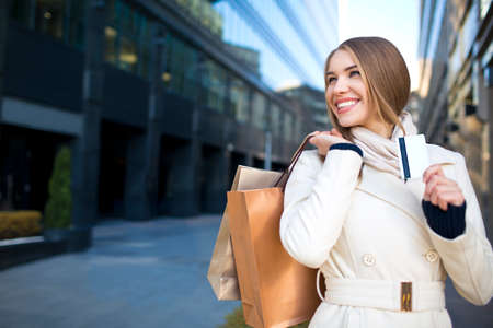 Young girl with bags and credit cardの写真素材