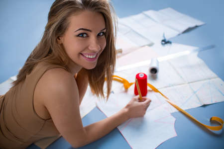 Young fashion designer in studioの写真素材