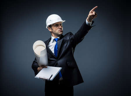 Man in a suit pointing the fingerの写真素材