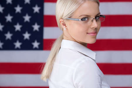 Young woman with American flagの写真素材