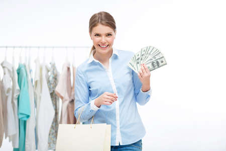 Woman with money and shopping bags