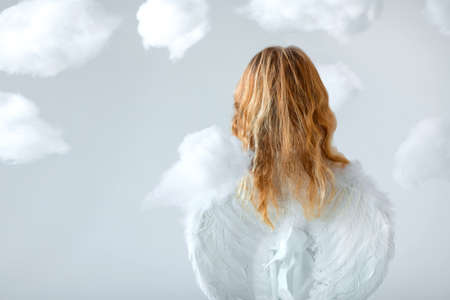 Angel with wings in the studioの写真素材