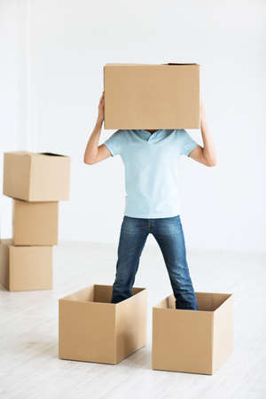 Man with a box at homeの写真素材