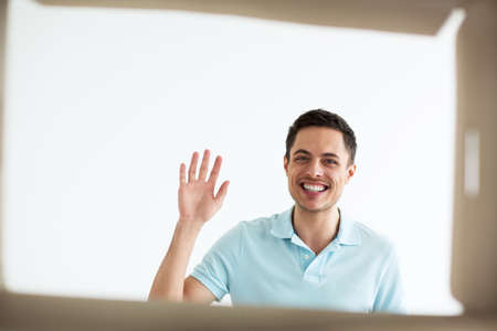 Young smiling man out of the boxの写真素材