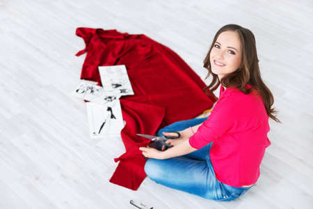 Young fashion designer in the studioの写真素材