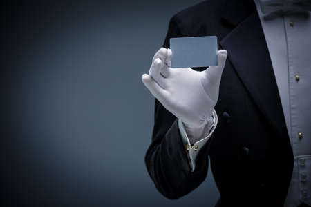 Man in a tuxedo with credit card