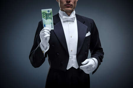 Man in a tuxedo with euroの写真素材