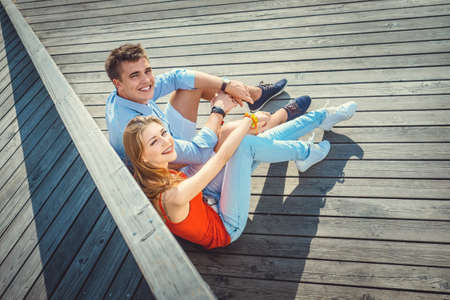 Young couple on wooden floorの写真素材