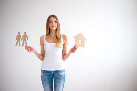 Young girl with a cardboard houseの写真素材