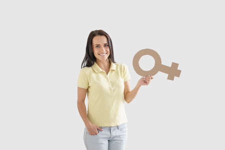 Young woman with cardboard objectsの写真素材