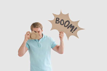 Young man with a cardboard objektの写真素材